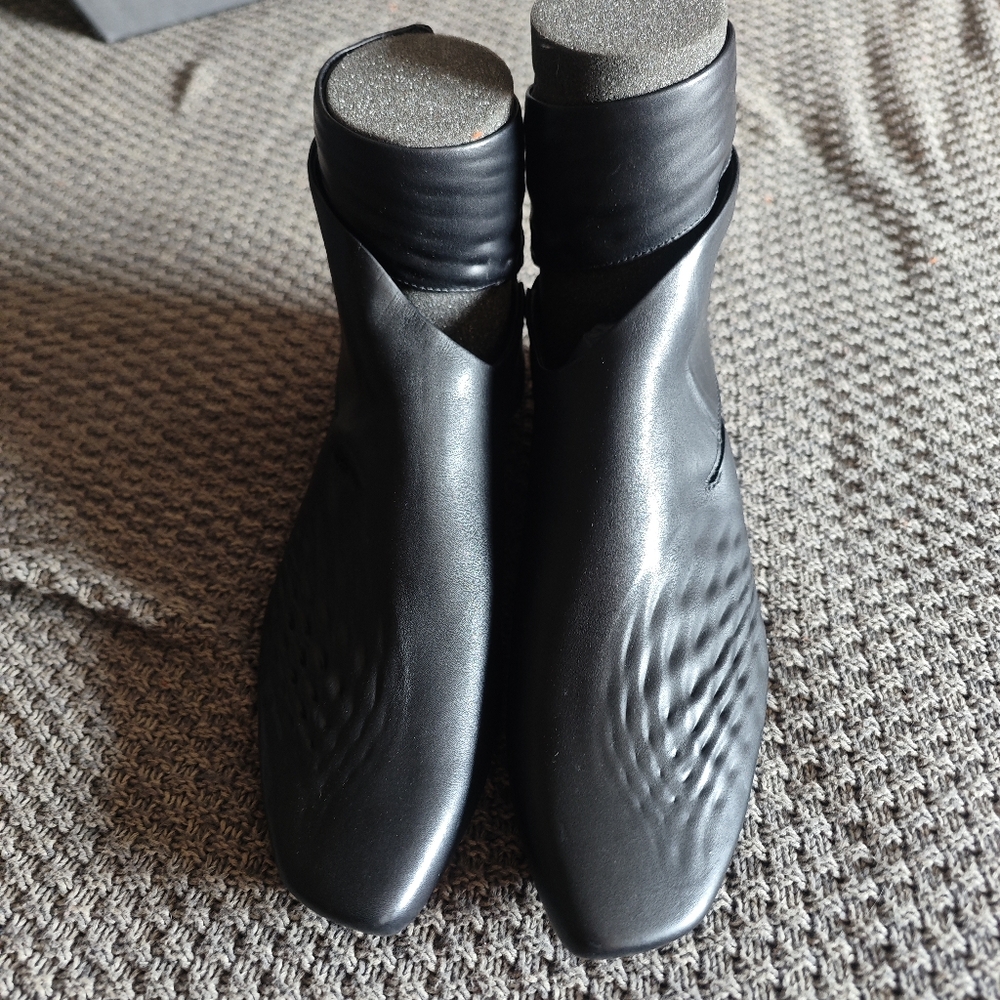 Zaha hadid x Lacoste boots with snap on straps